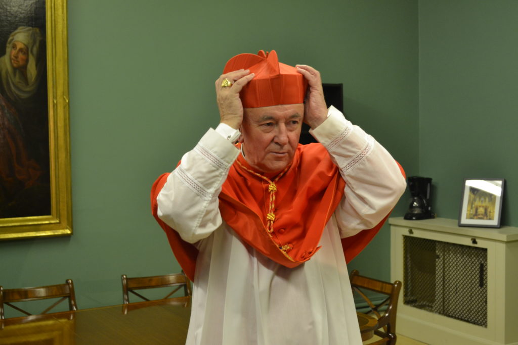 Cardinal Vincent Nichols trying on his new red biretta