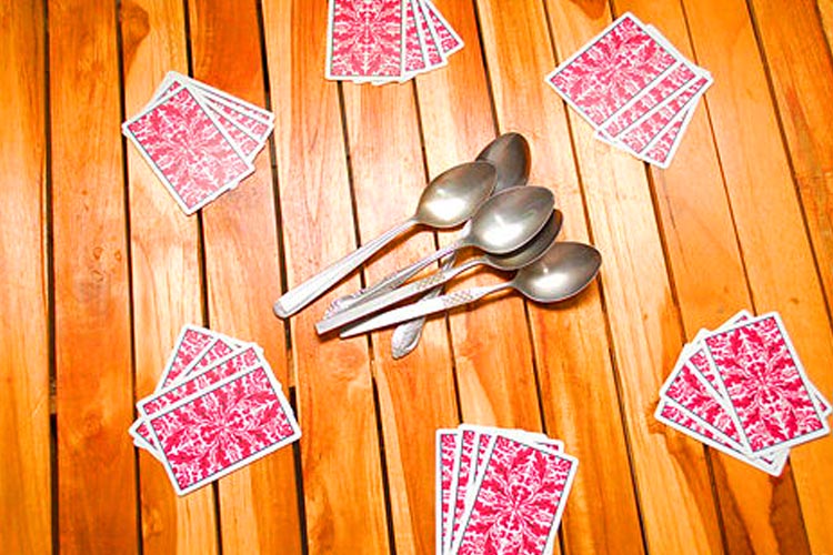 Spoons Card Game is a fast-paced card game were you must get a spoon before they are all gone!